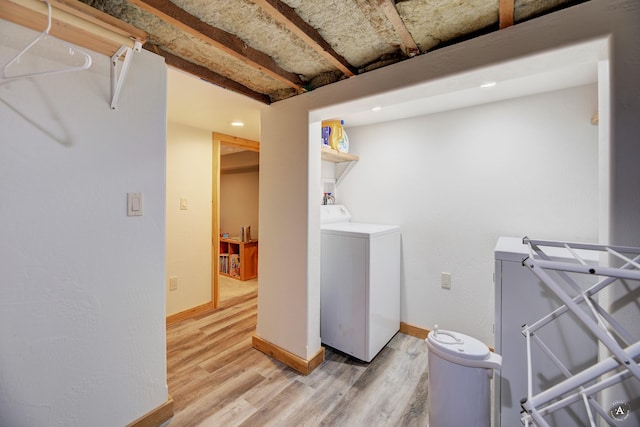 laundry area with hardwood / wood-style floors