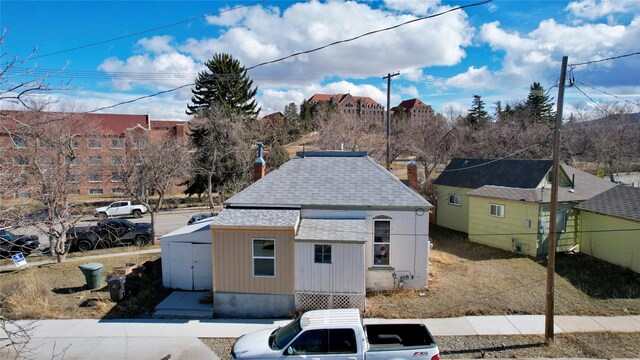 snow covered property with ac unit