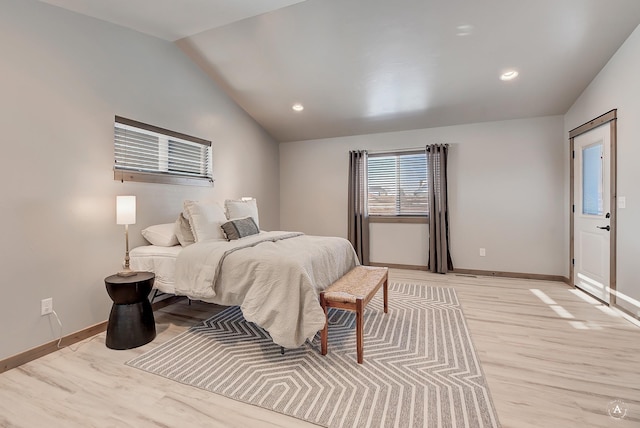 bedroom with light wood-style floors, recessed lighting, vaulted ceiling, and baseboards