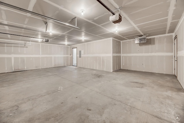 parking deck featuring electric panel and a garage door opener