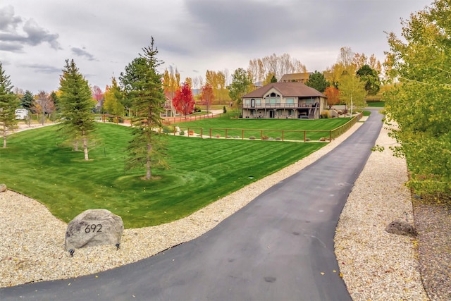 view of property's community with a lawn