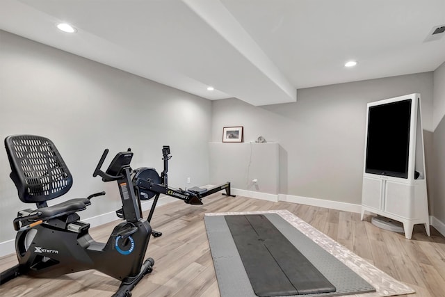 exercise area with light hardwood / wood-style floors