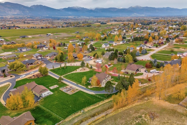 birds eye view of property featuring a mountain view