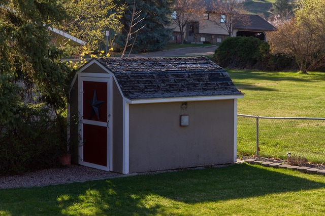 view of shed with fence