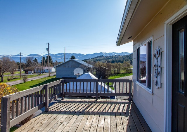 wooden terrace with a mountain view
