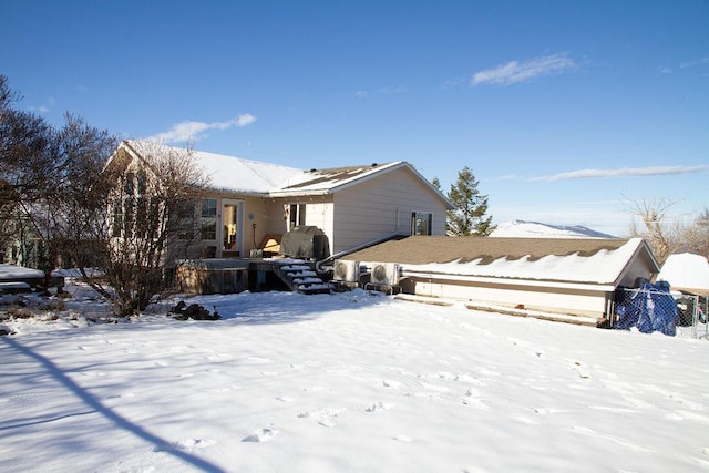 view of snow covered house