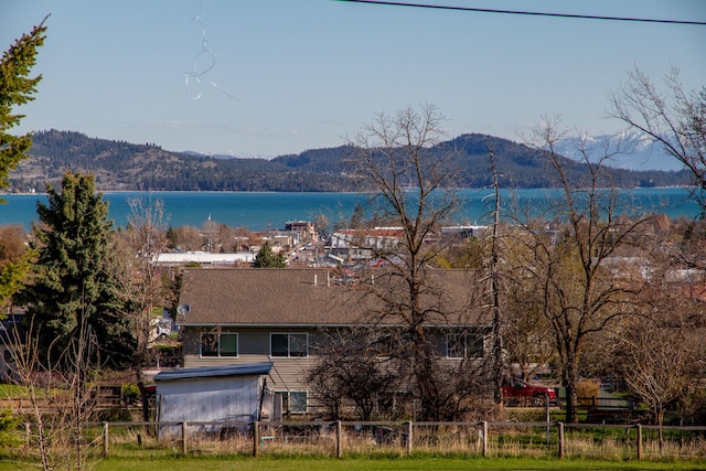 water view with fence and a mountain view