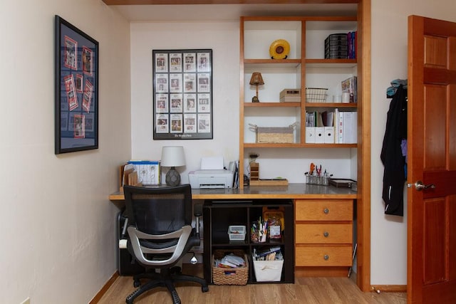 office featuring baseboards and wood finished floors
