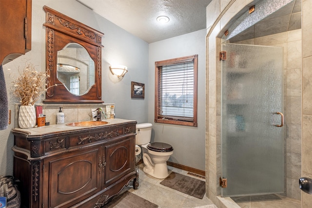 bathroom featuring a textured ceiling, an enclosed shower, vanity, backsplash, and toilet