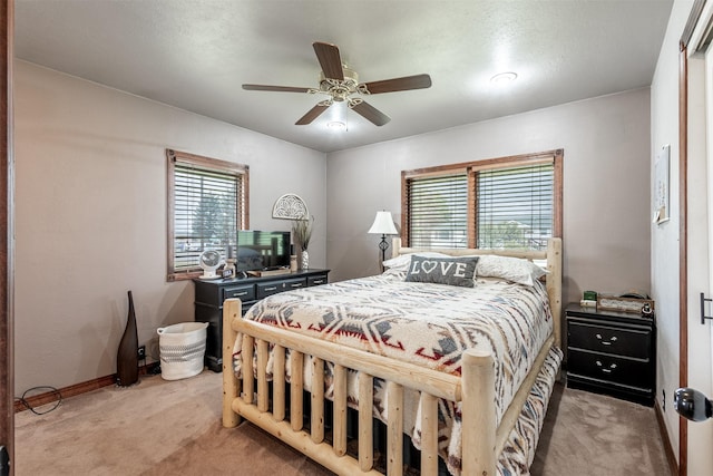 bedroom featuring ceiling fan and carpet flooring