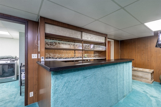 bar with a paneled ceiling, carpet, heating unit, and wooden walls