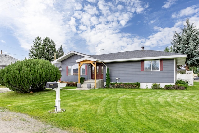 ranch-style house featuring a front lawn