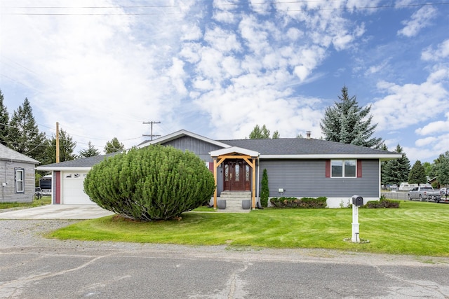 single story home with a front yard and a garage