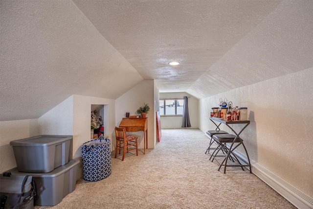 bonus room featuring a textured ceiling, lofted ceiling, and light carpet