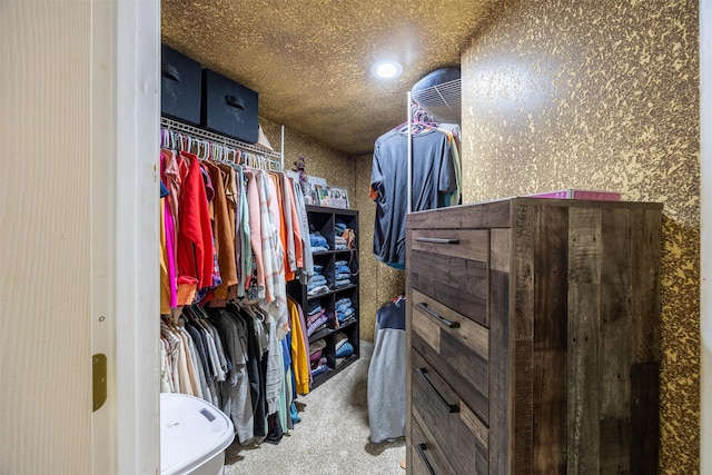 walk in closet featuring carpet floors