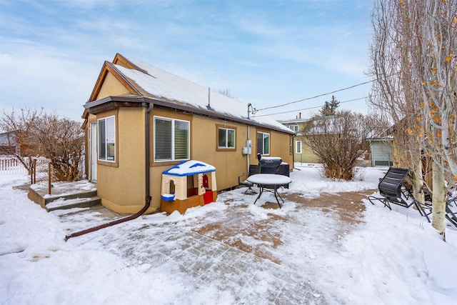 view of snow covered house