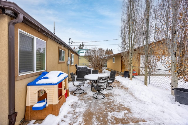 view of snow covered patio