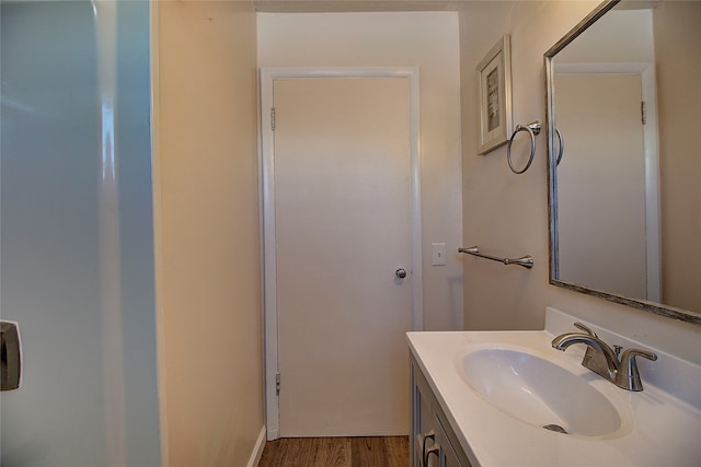 bathroom featuring vanity and hardwood / wood-style floors