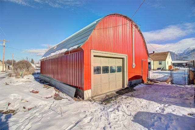 view of snow covered garage