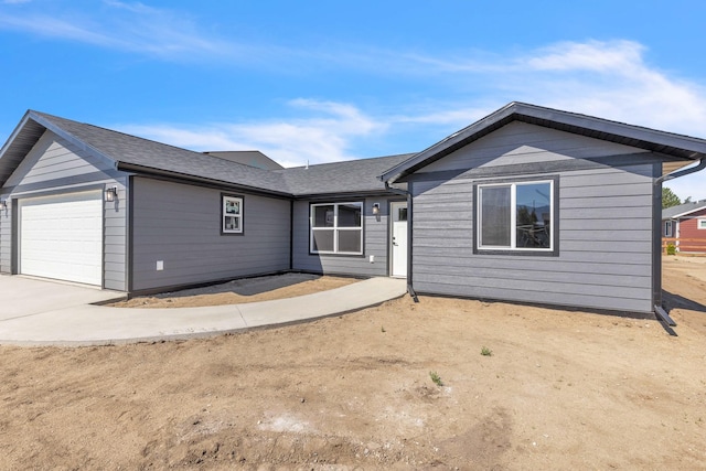 single story home with a garage