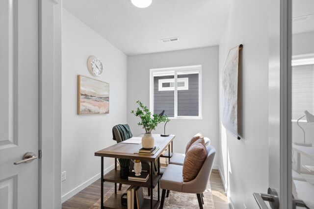 dining space featuring dark hardwood / wood-style flooring