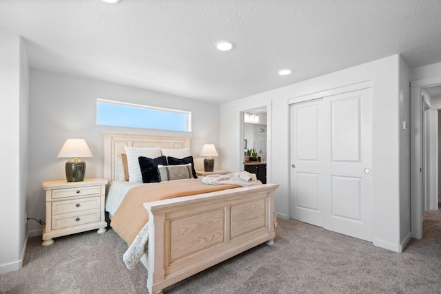 carpeted bedroom featuring a closet