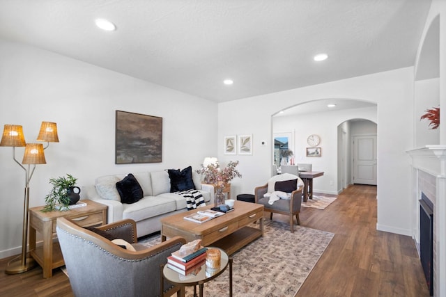 5843 Horn Rd, Missoula, MT 59808 - living area with arched walkways, wood finished floors, recessed lighting, and a fireplace