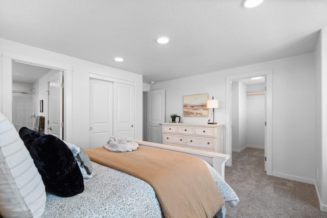 carpeted bedroom featuring a closet