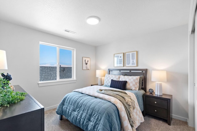 carpeted bedroom featuring a water view