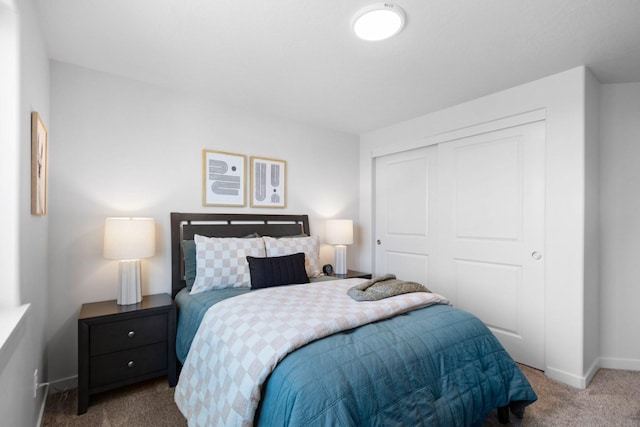 carpeted bedroom with a closet