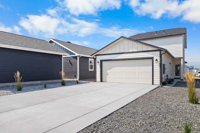 5843 Horn Rd, Missoula, MT 59808 - view of front of home with an attached garage, driveway, and board and batten siding