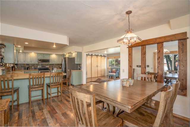 dining area with plenty of natural light, sink, an inviting chandelier, and dark hardwood / wood-style floors