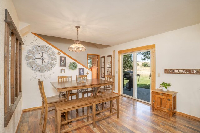 7 Hardy Cir, Ennis, MT 59729 - dining room featuring wood finished floors, a chandelier, and baseboards