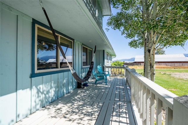 wooden deck featuring a mountain view