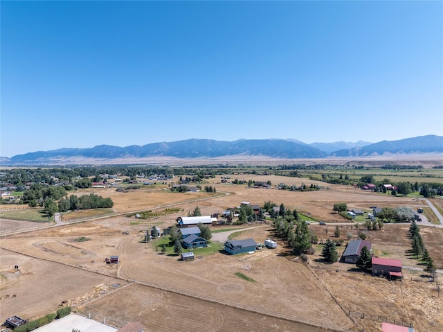 drone / aerial view featuring a mountain view and a rural view