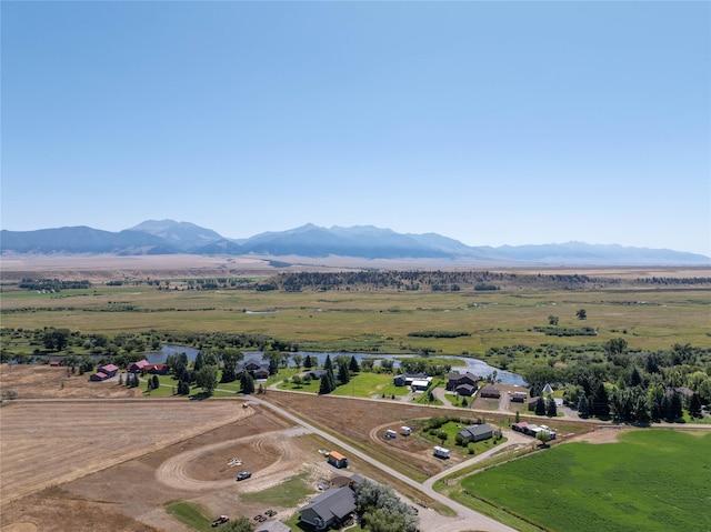 drone / aerial view with a mountain view and a rural view