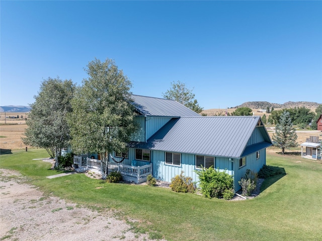 7 Hardy Cir, Ennis, MT 59729 - view of front of home with a front yard, metal roof, and a porch