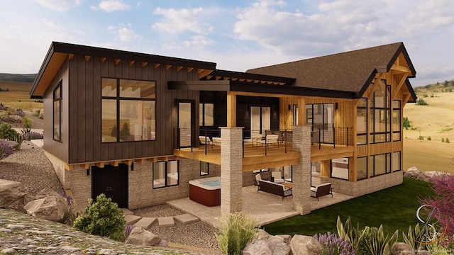 rear view of property with an outdoor living space, a hot tub, and a patio