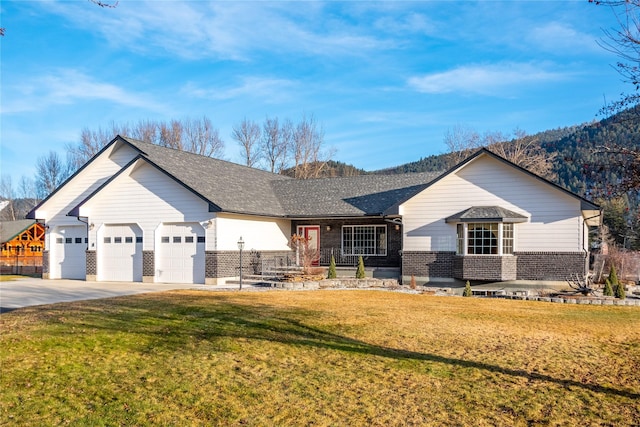 single story home featuring a front lawn and a garage