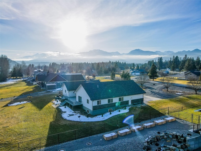 birds eye view of property with a mountain view