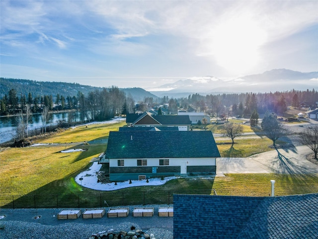 drone / aerial view with a water and mountain view