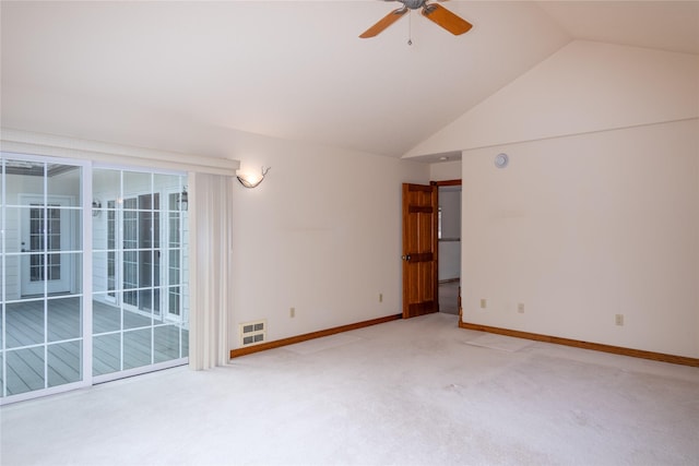 carpeted empty room featuring vaulted ceiling and ceiling fan