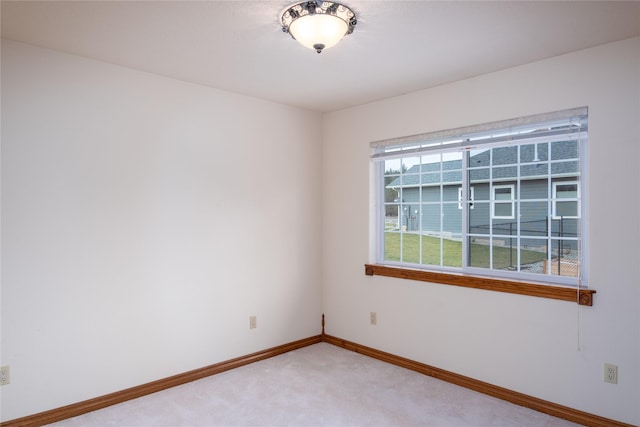 unfurnished room featuring carpet