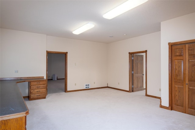 spare room with light colored carpet