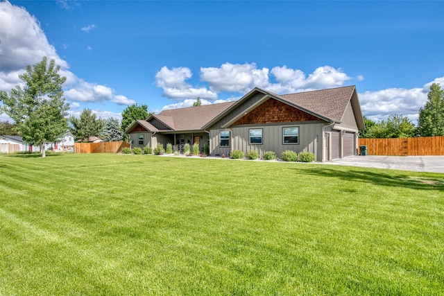 view of front facade featuring a garage and a front lawn