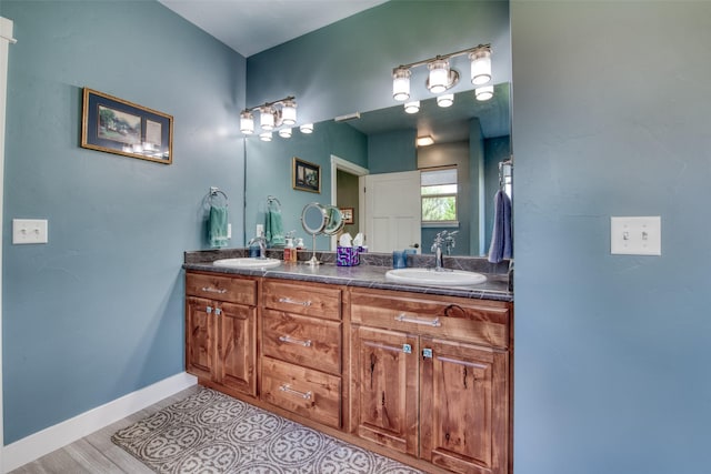 bathroom with vanity and hardwood / wood-style floors