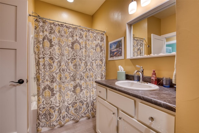 bathroom featuring vanity and shower / tub combo