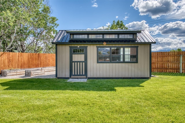 view of outbuilding featuring a lawn