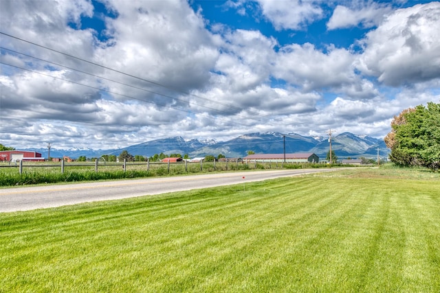 view of yard featuring a rural view and a mountain view