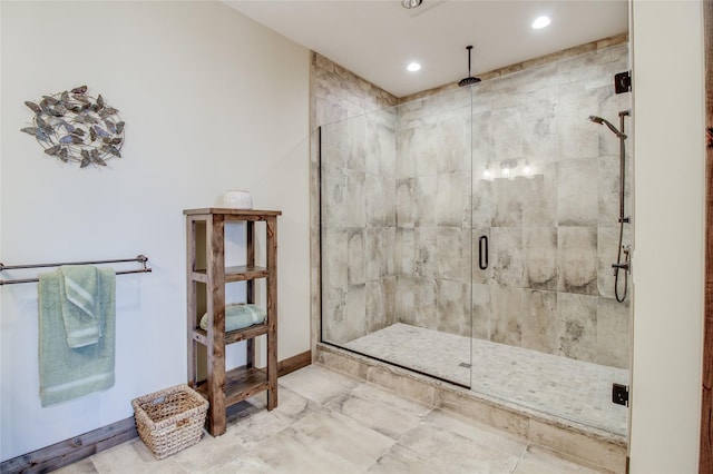 bathroom featuring a shower with door